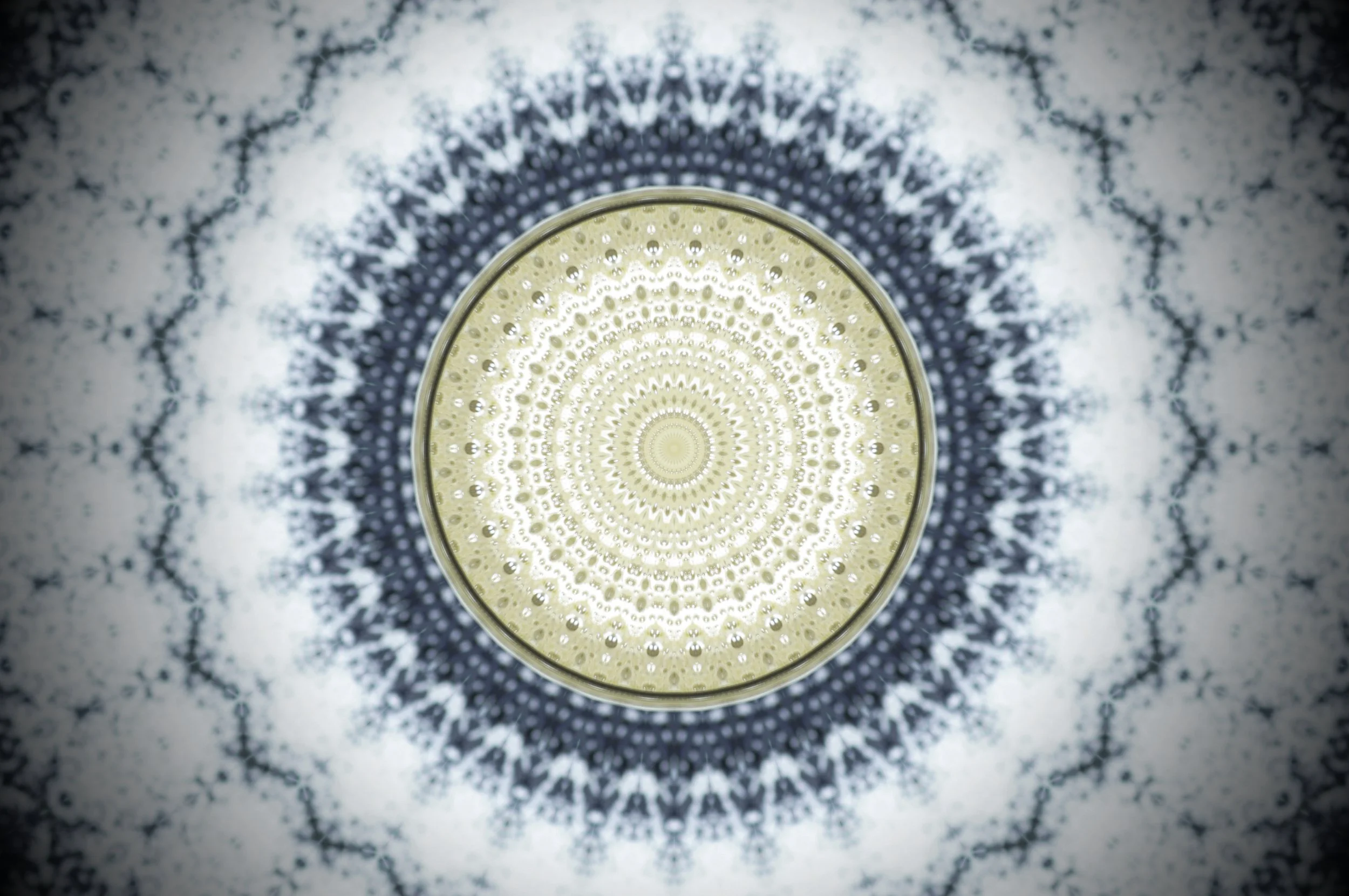 Circular artwork with radiating blue and gold patterns